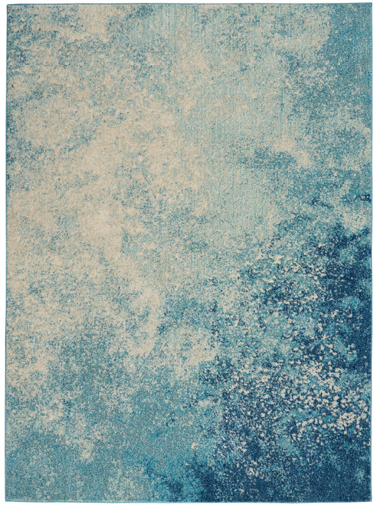Blue-beige abstract area rug with textured, marbled teal gradient.