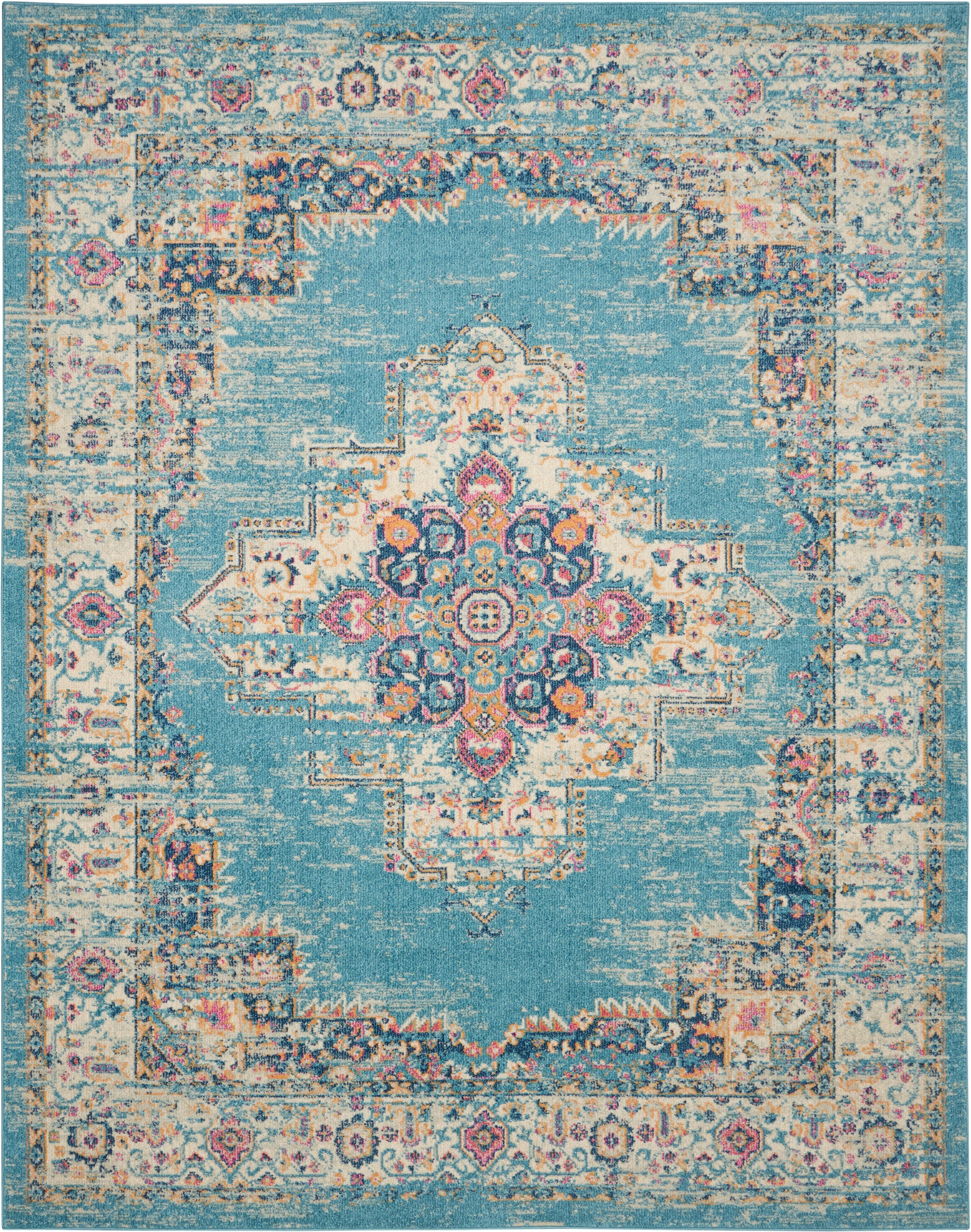 Turquoise distressed Bohemian rug with an ornate central medallion in pink, cream, and navy; decorative floral border.