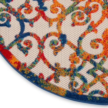 Round area rug with vivid multicolor scrollwork in orange, blue, red & green on ivory, navy edge.