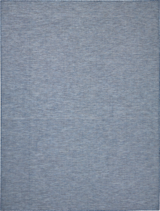 Denim blue flat-weave rug with subtle tonal texture, rectangular, versatile living room floor decor.