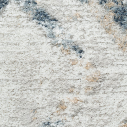Cream shag rug with blue and beige speckled pattern; soft high-pile texture for living room or bedroom decor