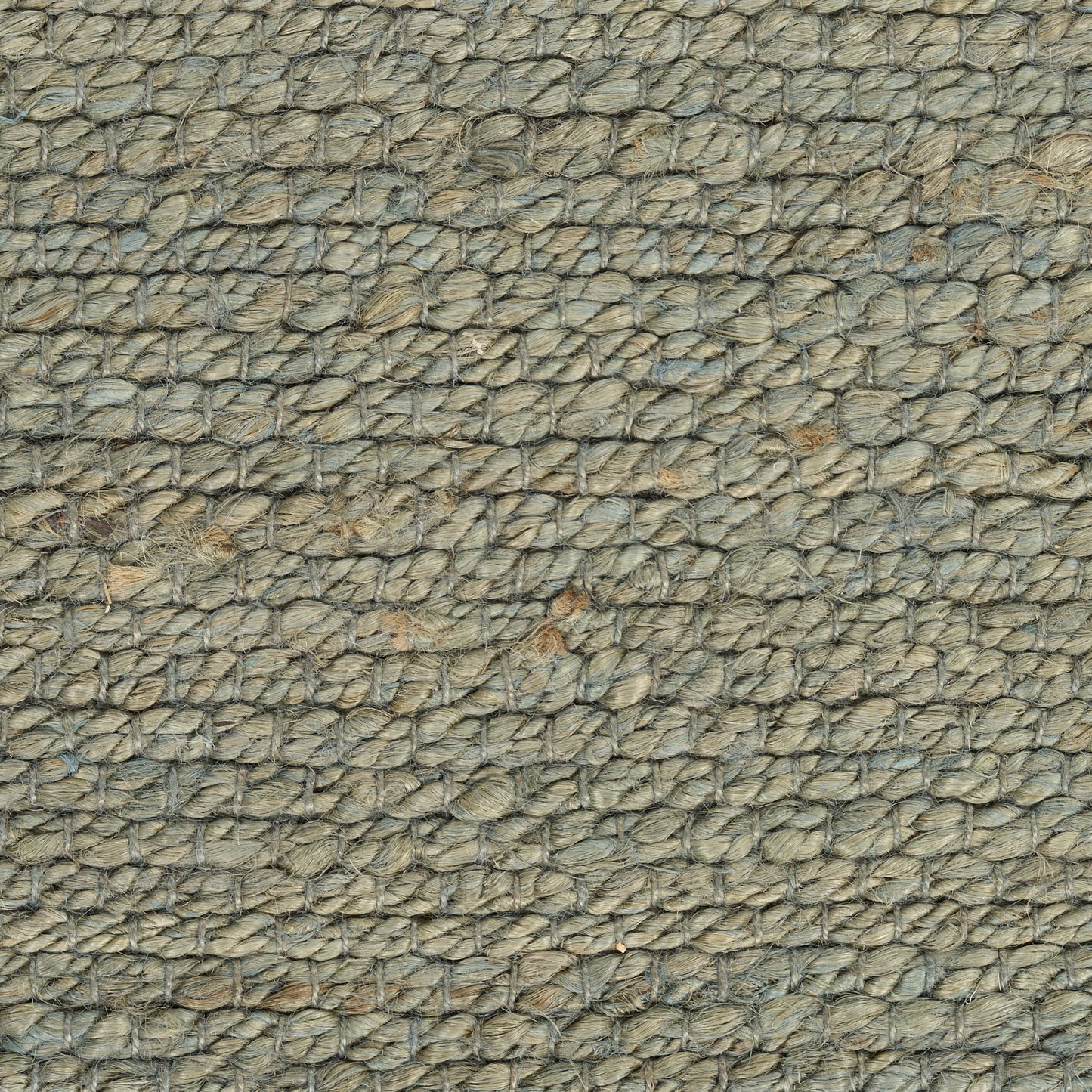 Close-up of a coarse beige braided rope texture with looped fibers; rustic nautical rug/mat material.