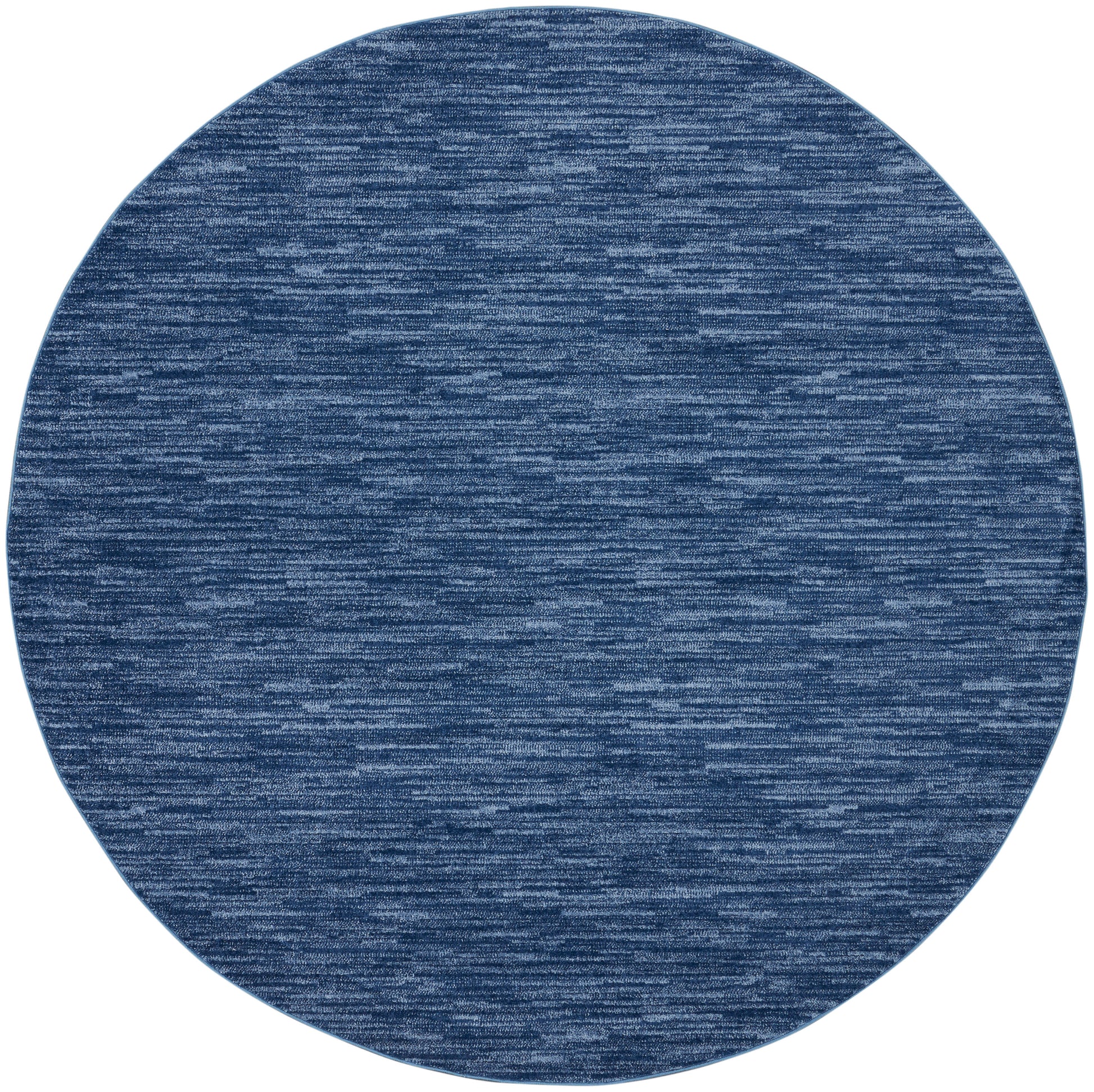 Round blue woven outdoor rug with denim heather texture; 10' round, suitable for patio or deck.
