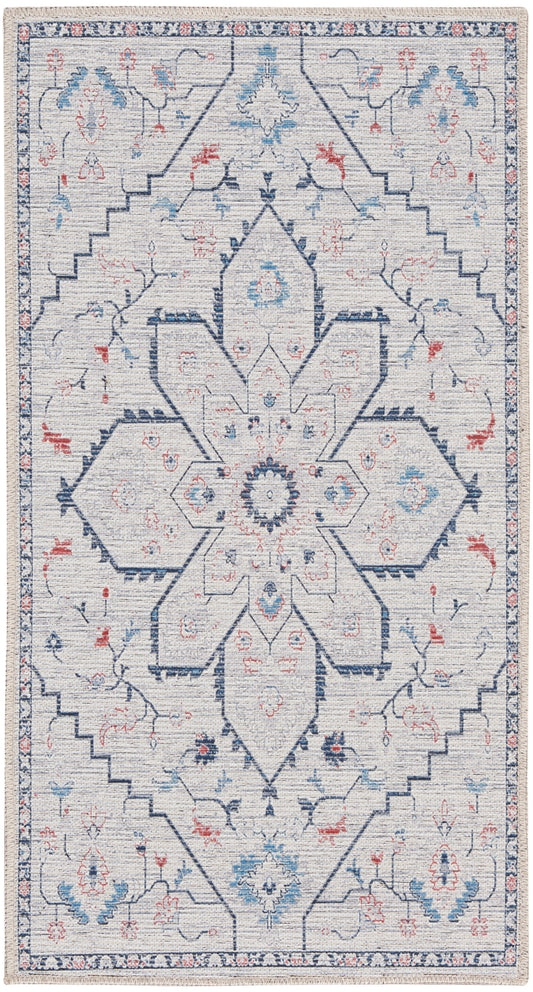 Ivory area rug with blue and red geometric floral medallion, farmhouse style, fringed edges
