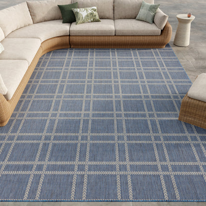 Blue plaid area rug with beige grid lines (8' x 10').