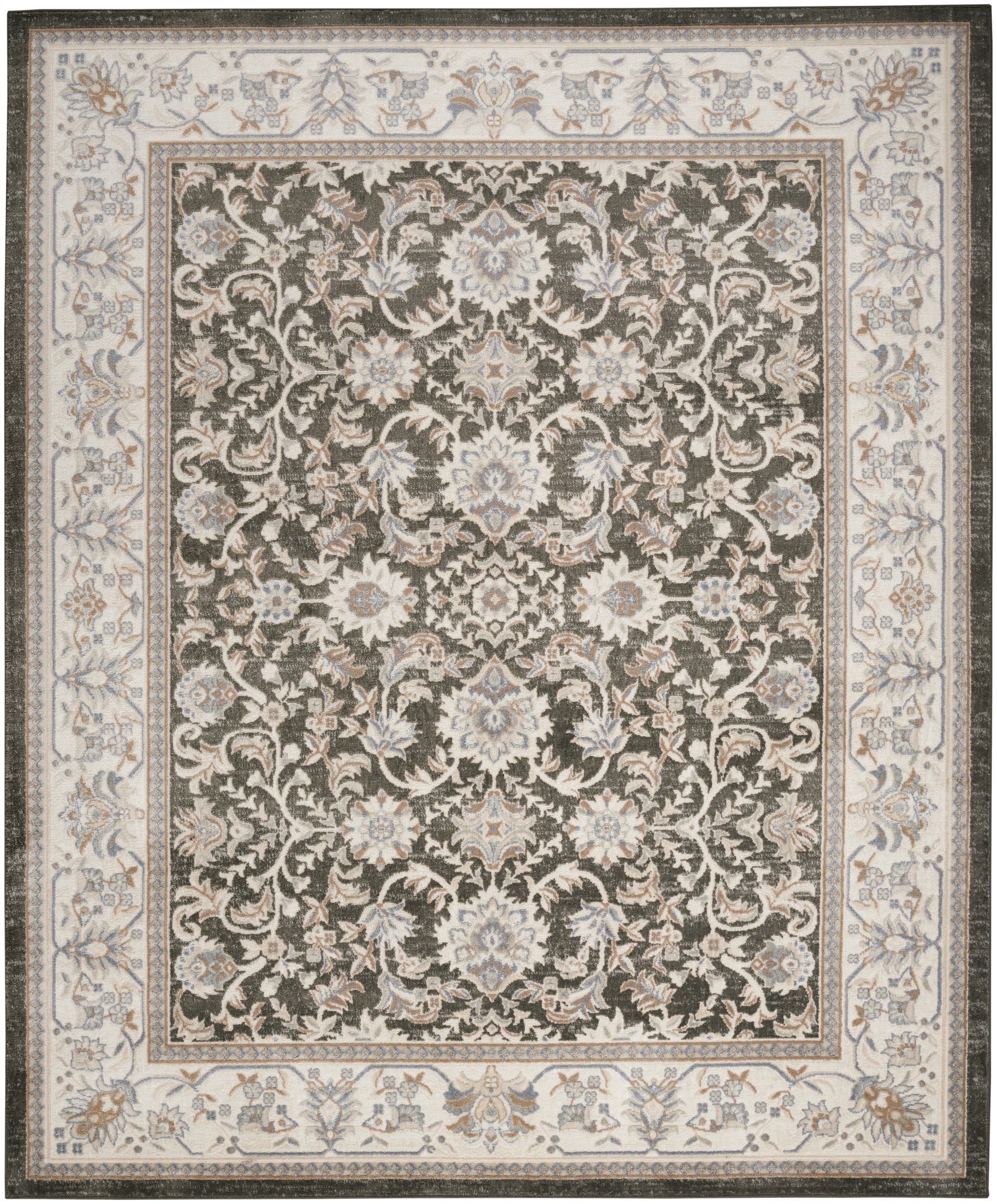 Rectangular oriental rug with dark central field and pale blue floral medallions; ivory border with blue-tan florals.