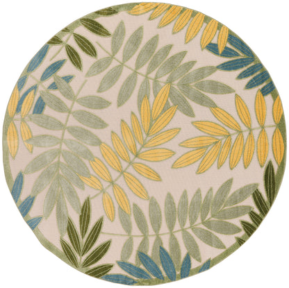 Round rug with yellow, green and blue fern leaves on beige background; botanical pattern.