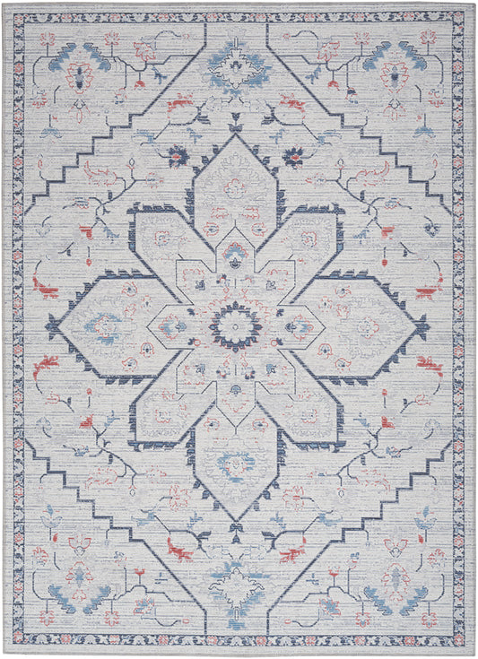 Blue ivory geometric oriental rug with large central floral medallion, pale blue accents, stepped border.