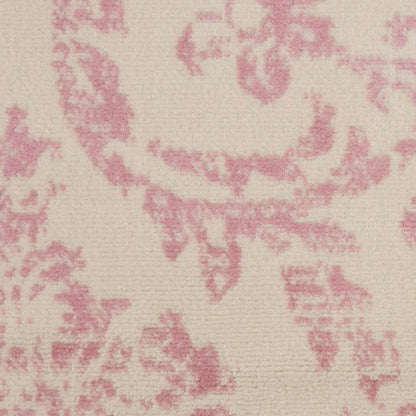 Cream-beige fabric with pink damask floral pattern, vintage upholstery textile.