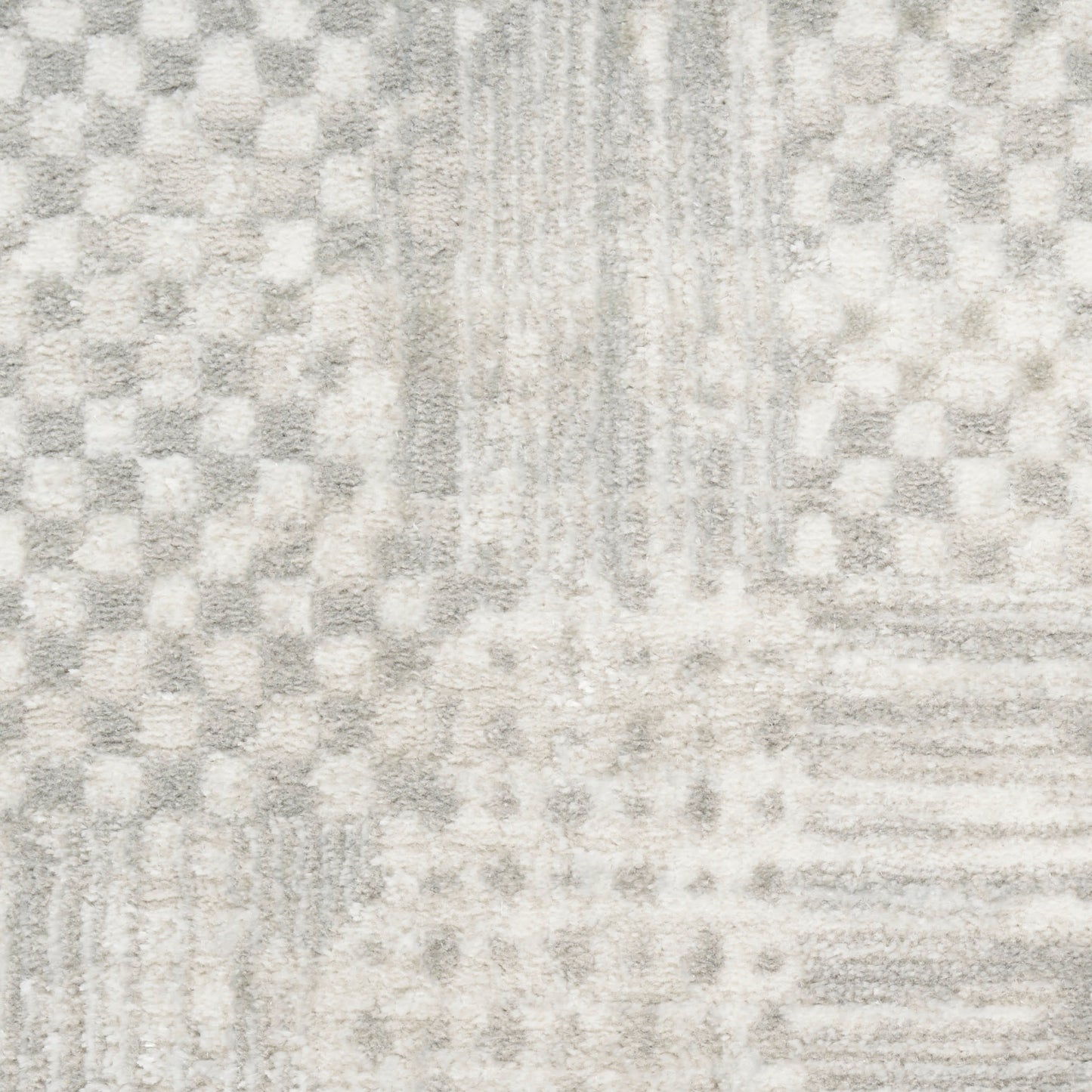 Soft gray and ivory area rug with a subtle checkered and striped geometric pattern.