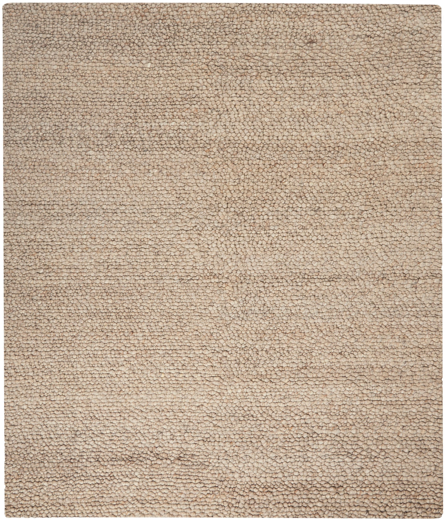 Beige textured shag rug with dense loop pile; soft neutral rug.