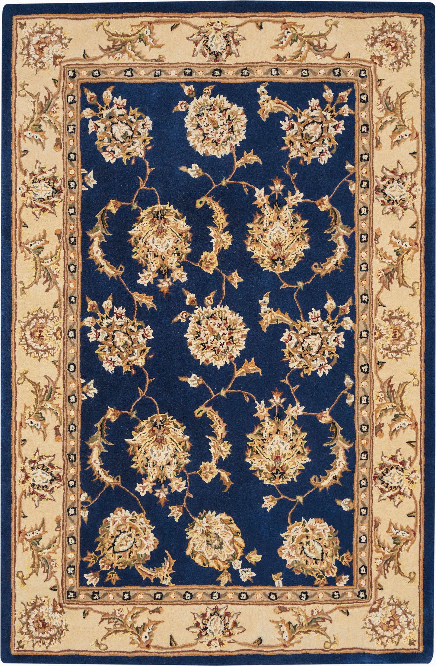 Rectangular Persian-style rug: deep navy field with cream floral bouquets and a beige border; living-room area rug.