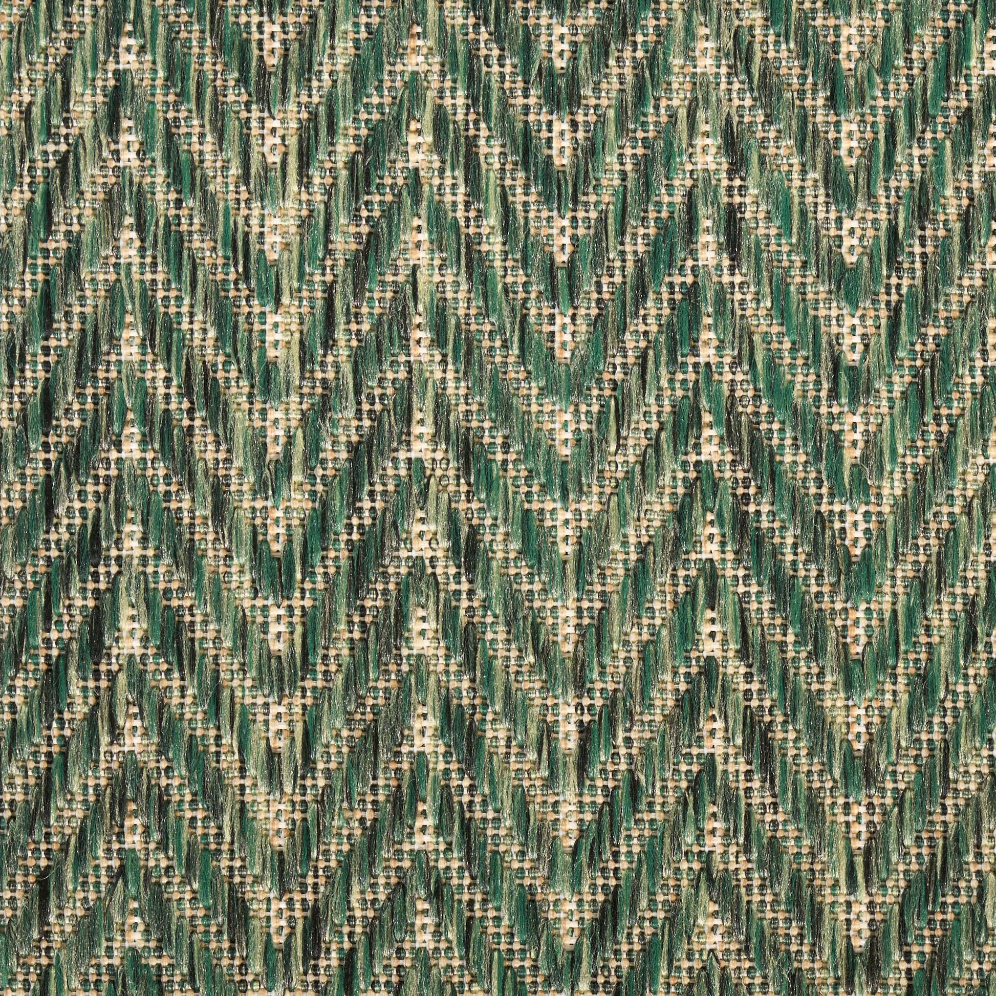 Close-up of green and beige chevron woven fabric with a tweed texture, upholstery or rug material.