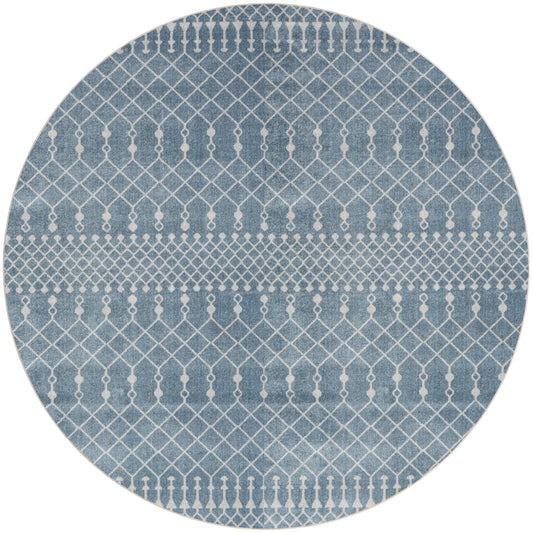 Round blue rug with white geometric lattice and diamond stripe pattern.