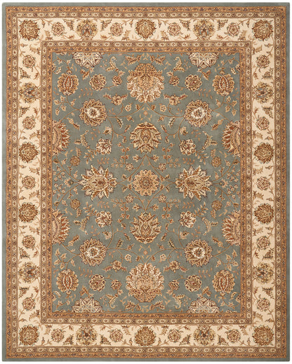 Persian-style area rug with blue field and ornate cream border in gold-toned floral design.