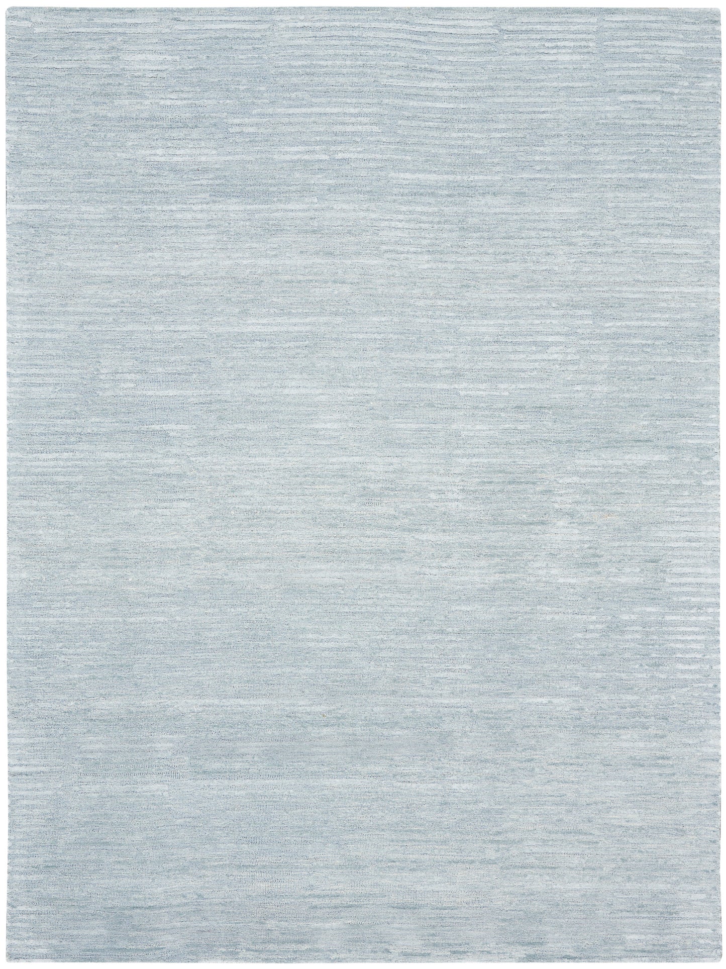 Light blue-gray rug with soft, subtle tonal variations and a flat-weave texture; rectangular, modern living room decor.