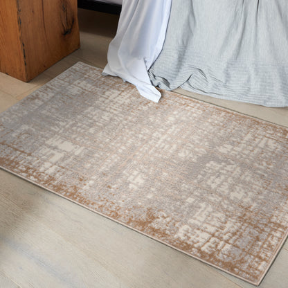 Rectangular area rug in beige, taupe and light gray with an abstract pattern; soft low-pile.