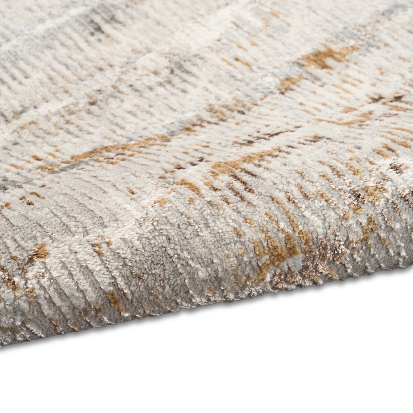 Neutral-toned plush area rug with beige, gray, and tan abstract pattern and soft cut-pile texture.
