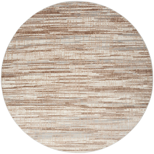 Round area rug in neutral beige and tan tones with abstract horizontal brushstroke pattern.