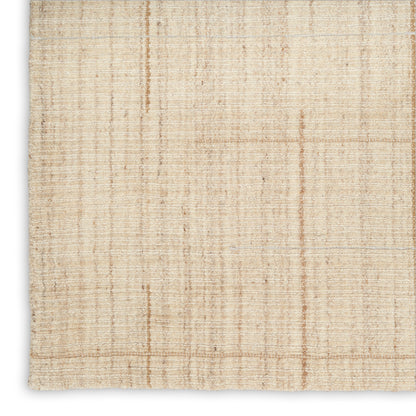 Beige woven rug with subtle tan plaid lines; natural fiber texture for warm neutral interiors.