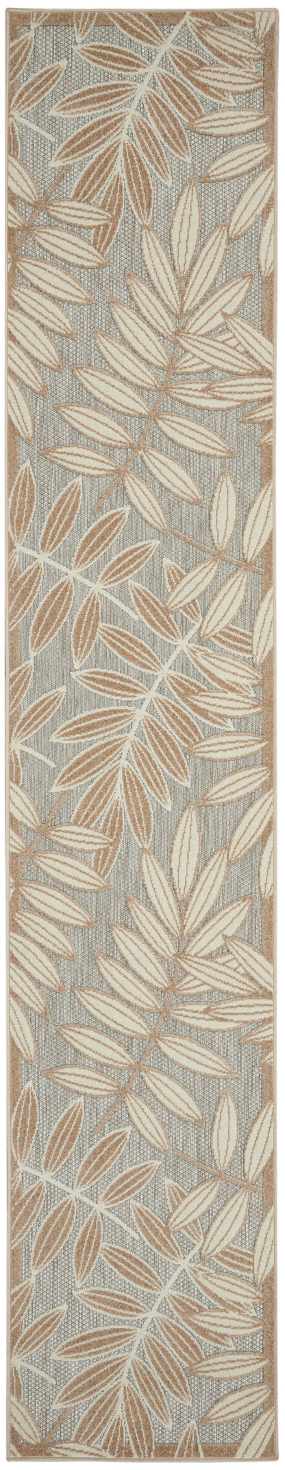 Narrow woven runner rug with beige leaf pattern on gray background and tan border