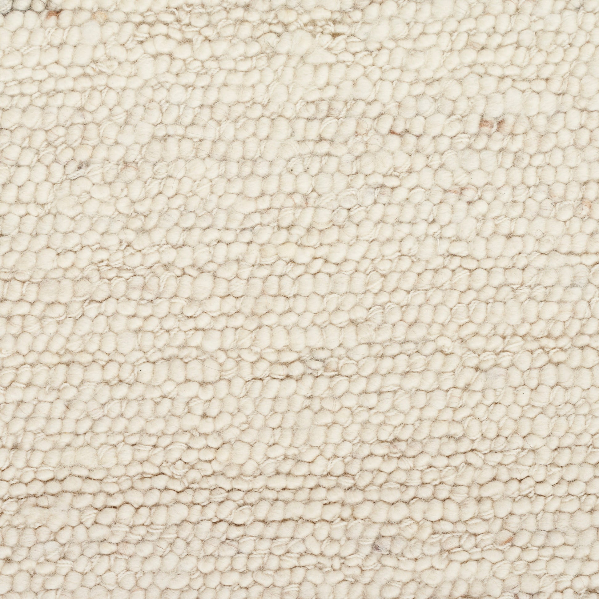 Cream boucle rug close-up with dense looped pile, soft and cozy.