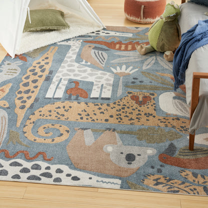 Colorful kids' area rug with animal motifs (giraffe, bear, elephant) in blues and tans; plush, cozy playroom decor.