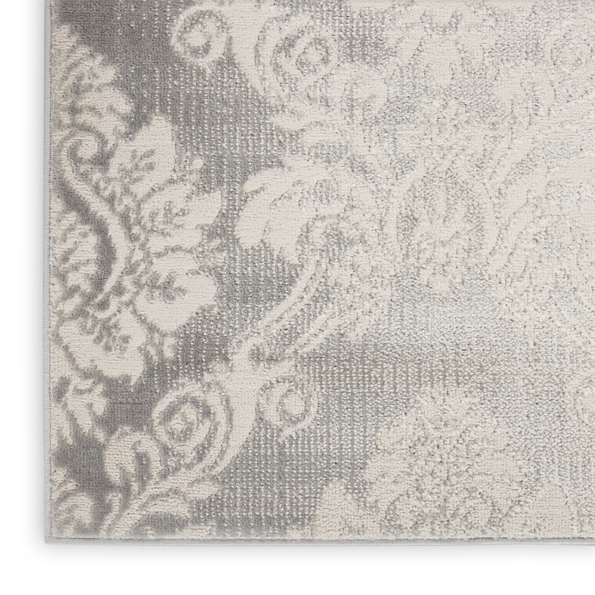 Vintage damask-patterned rug in ivory and gray with ornate floral motifs and woven texture, 4' x 6'.