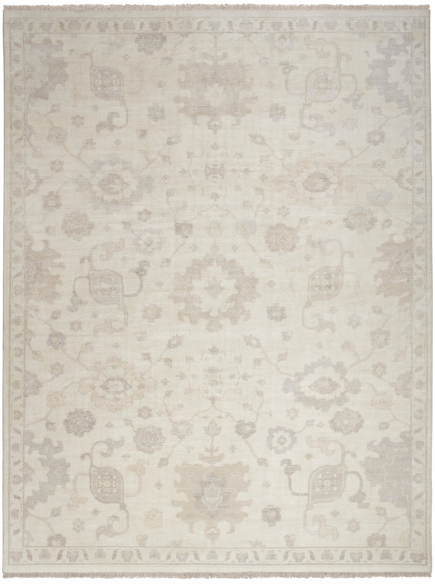 Cream-beige oriental rug with subtle floral medallions and light border; neutral, vintage-inspired decor.
