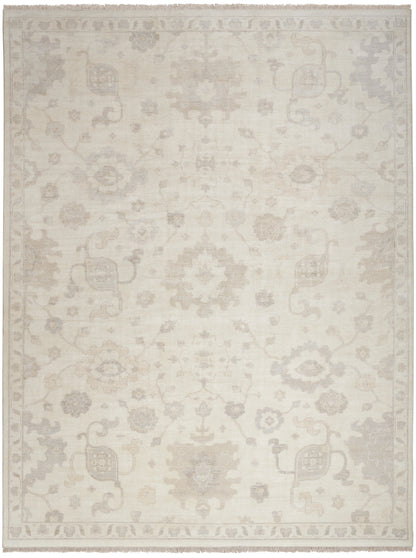Cream-beige oriental rug with subtle floral medallions and light border; neutral, vintage-inspired decor.