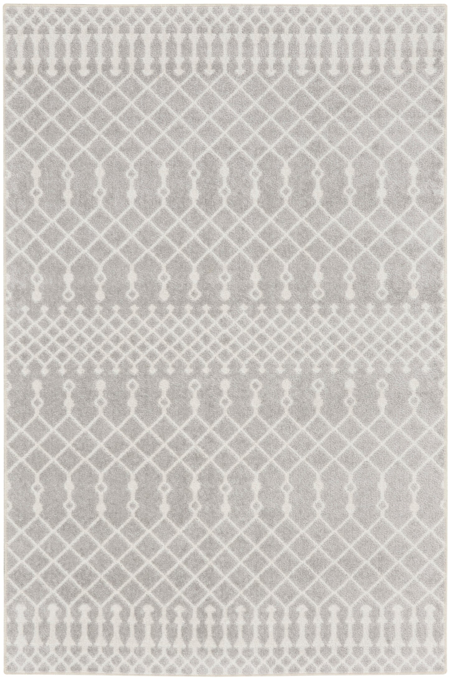 Gray woven rug with white trellis and lattice patterns for a modern, neutral living space.