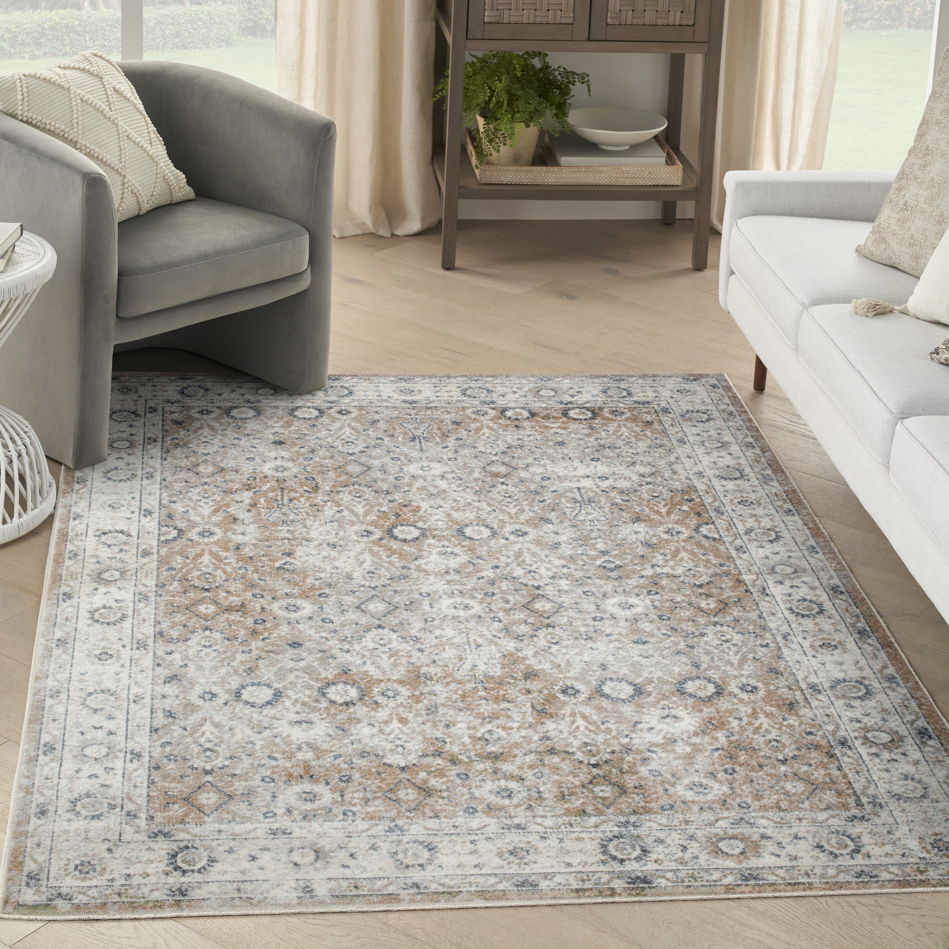 Rectangular traditional oriental rug in beige, blue and gray tones with a soft pile, ideal for a living room.
