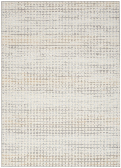 Neutral-toned area rug with a subtle geometric diamond-dot pattern in cream, gray and tan.