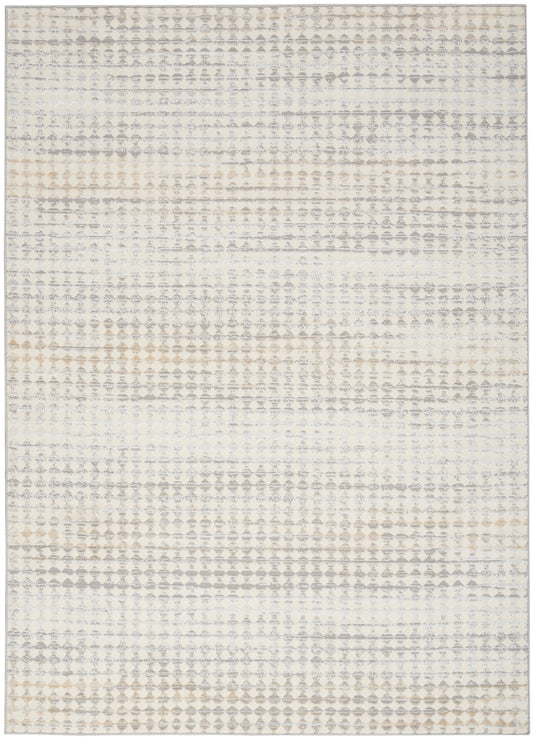 Neutral-toned area rug with a subtle geometric diamond-dot pattern in cream, gray and tan.