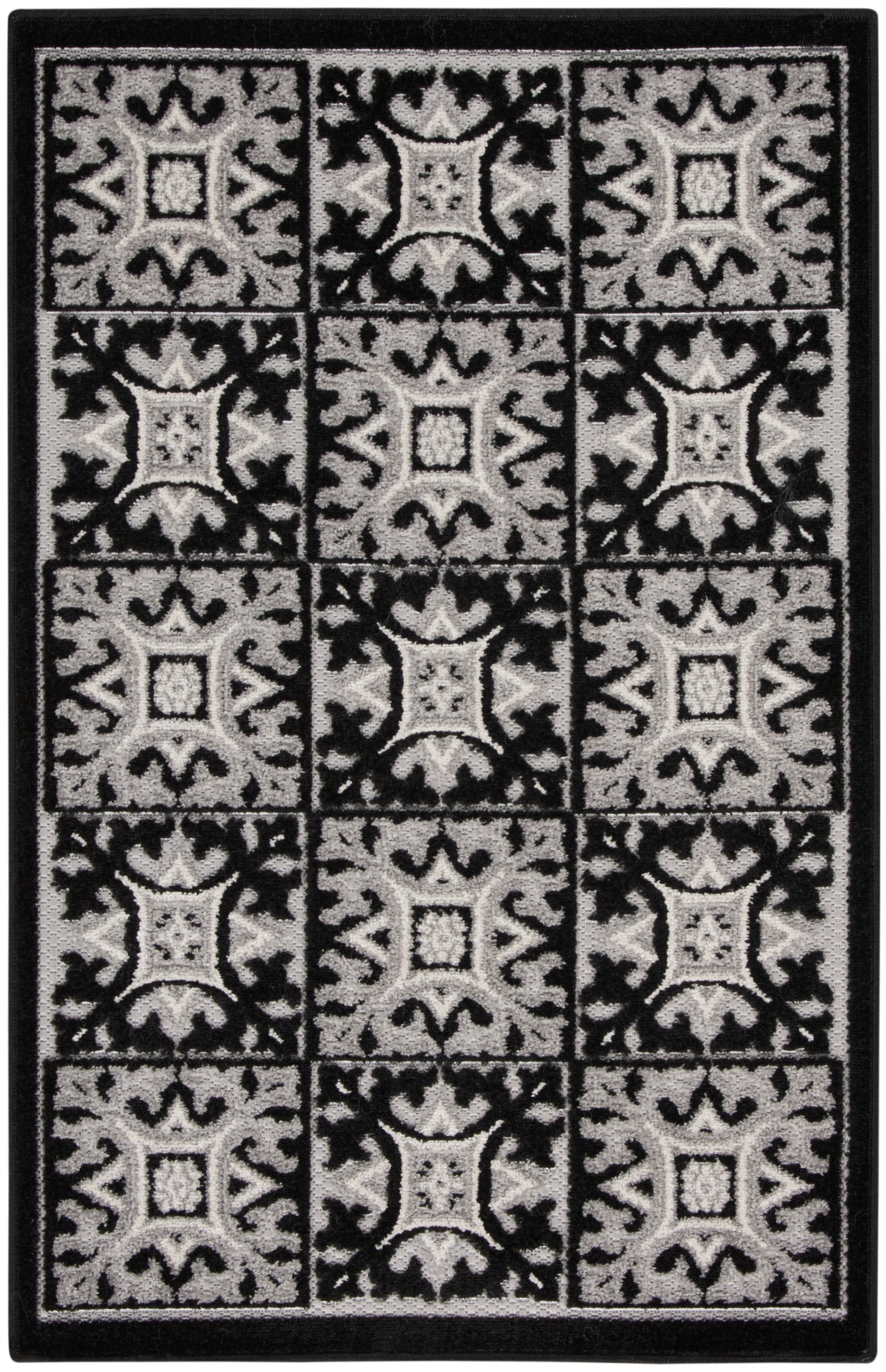 Black and gray patterned rug with a grid of ornate square tiles and a solid border.