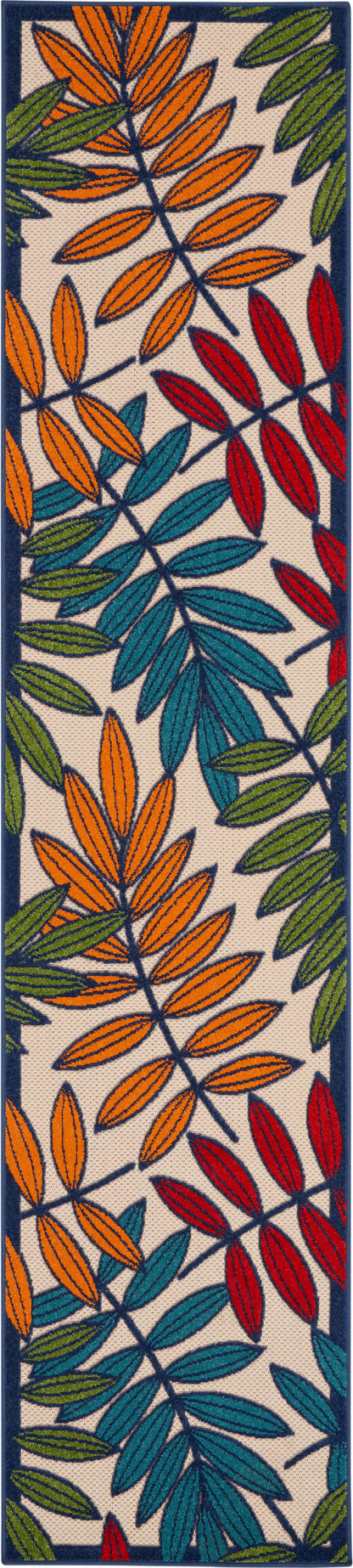 Long woven rug runner with bold orange, teal, green and red leaf motifs on beige with navy border.