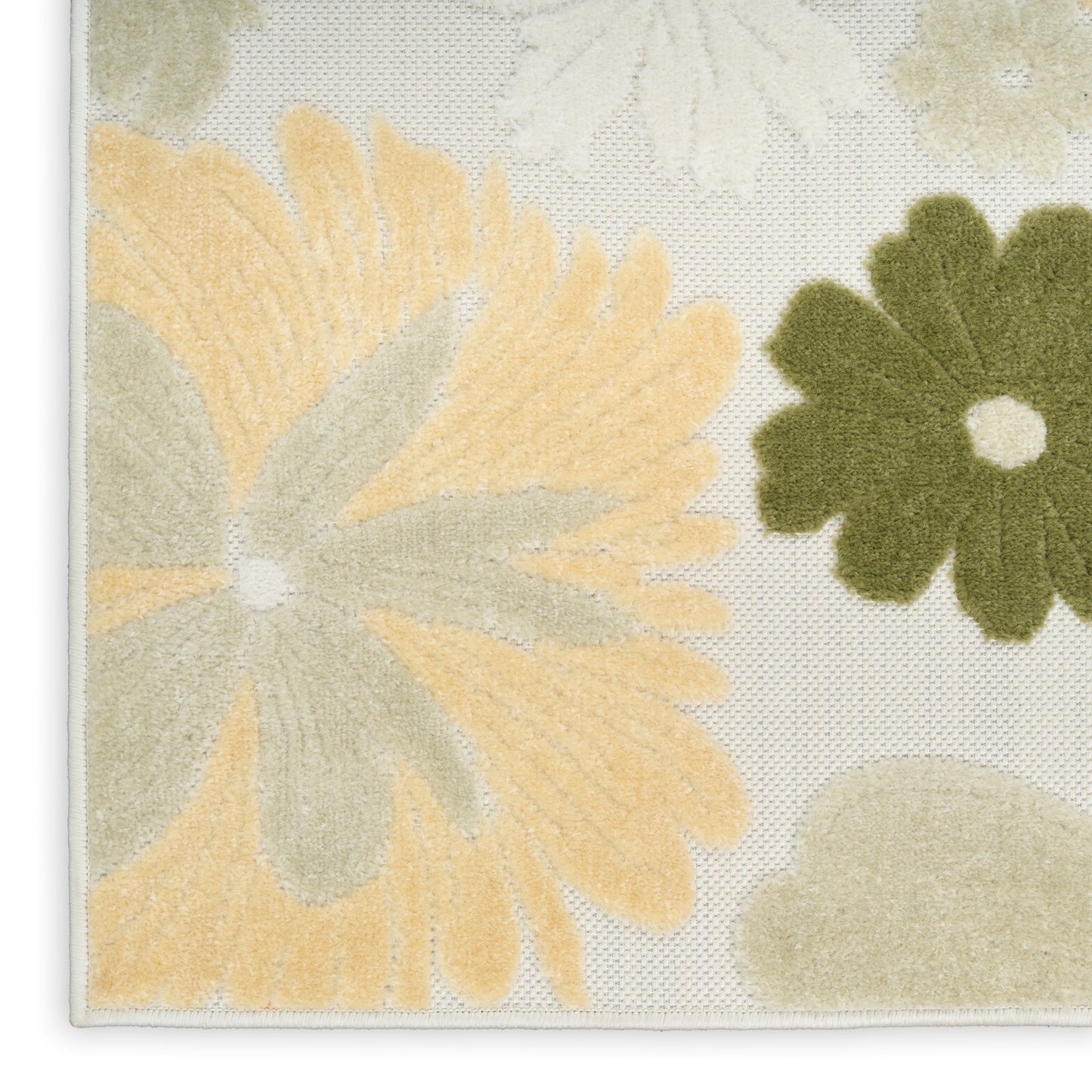 Cream floral rug with oversized pale yellow and olive petals on a textured woven backdrop, bordered edge.
