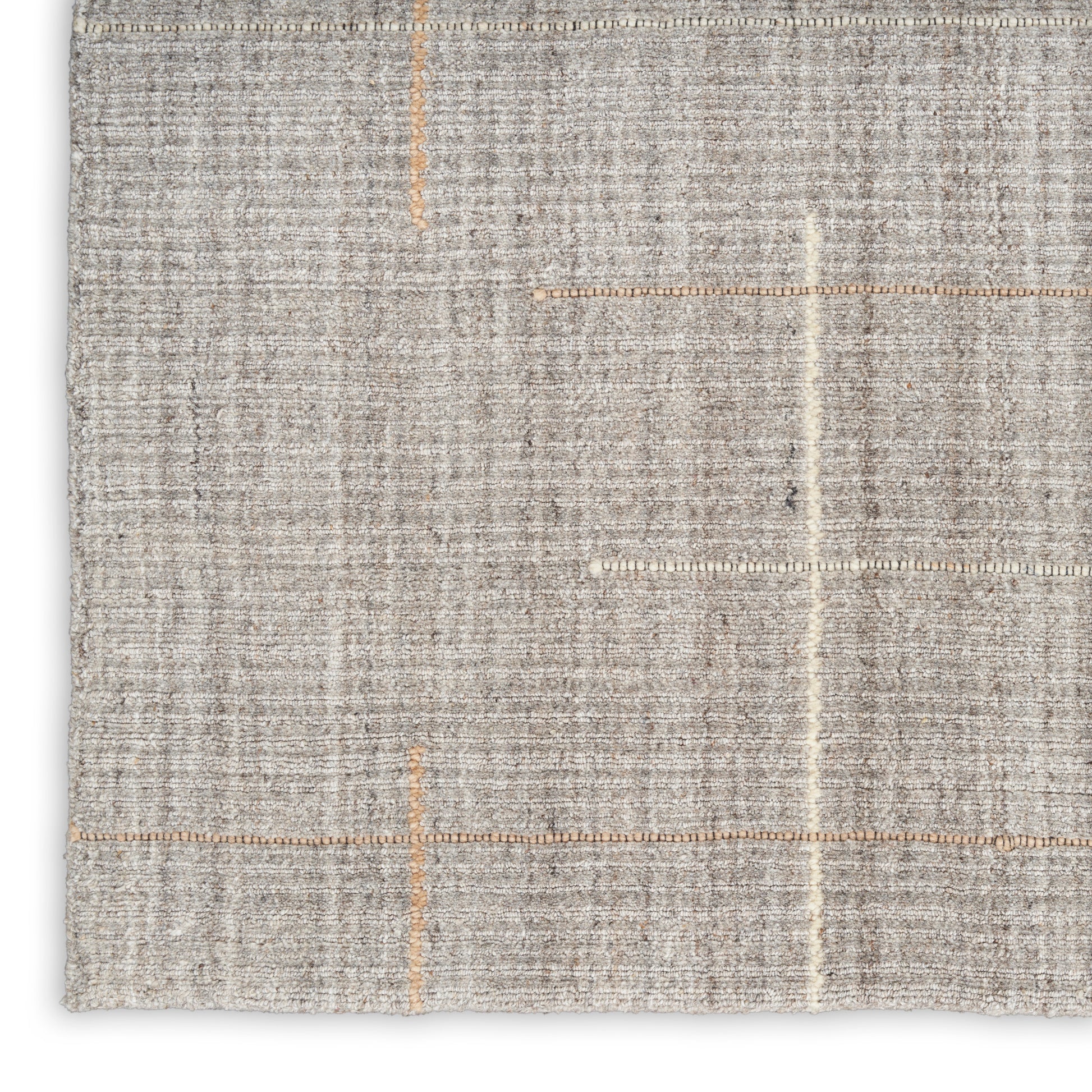 Light gray flat-weave rug with textured finish and orange stitched grid accents.