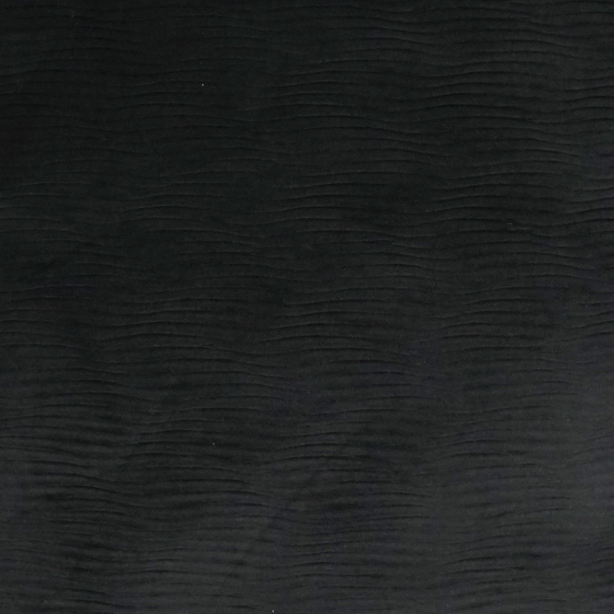 Black solid pillow with subtle horizontal ripple texture and soft matte finish; 24" x 24