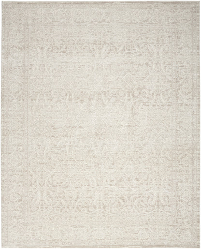 Cream rectangular rug with subtle distressed beige Oriental pattern; soft, versatile decor accent.