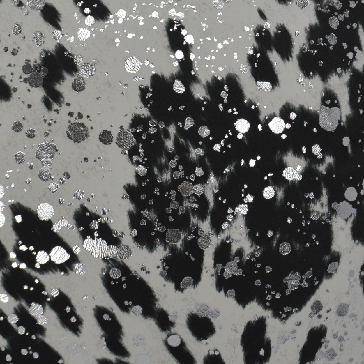 Gray fabric with black abstract splotches and silver glitter spots; modern metallic print.