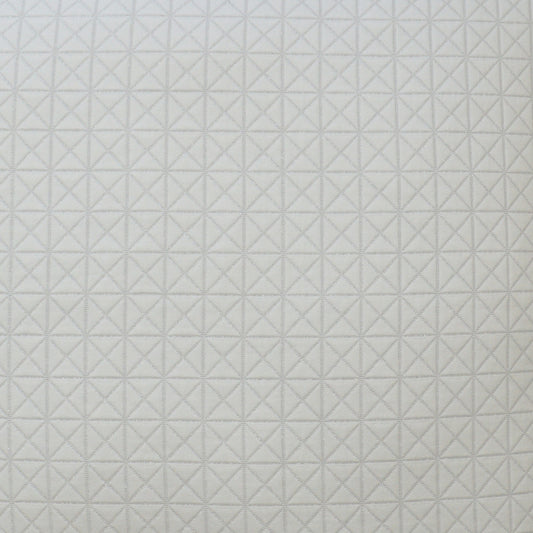 Light gray fabric with a geometric diamond/star quilt pattern, a soft textile for upholstery or home decor.