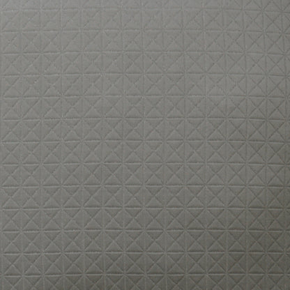 Light gray pillow with a subtle quilted grid of small X-shaped stitches.