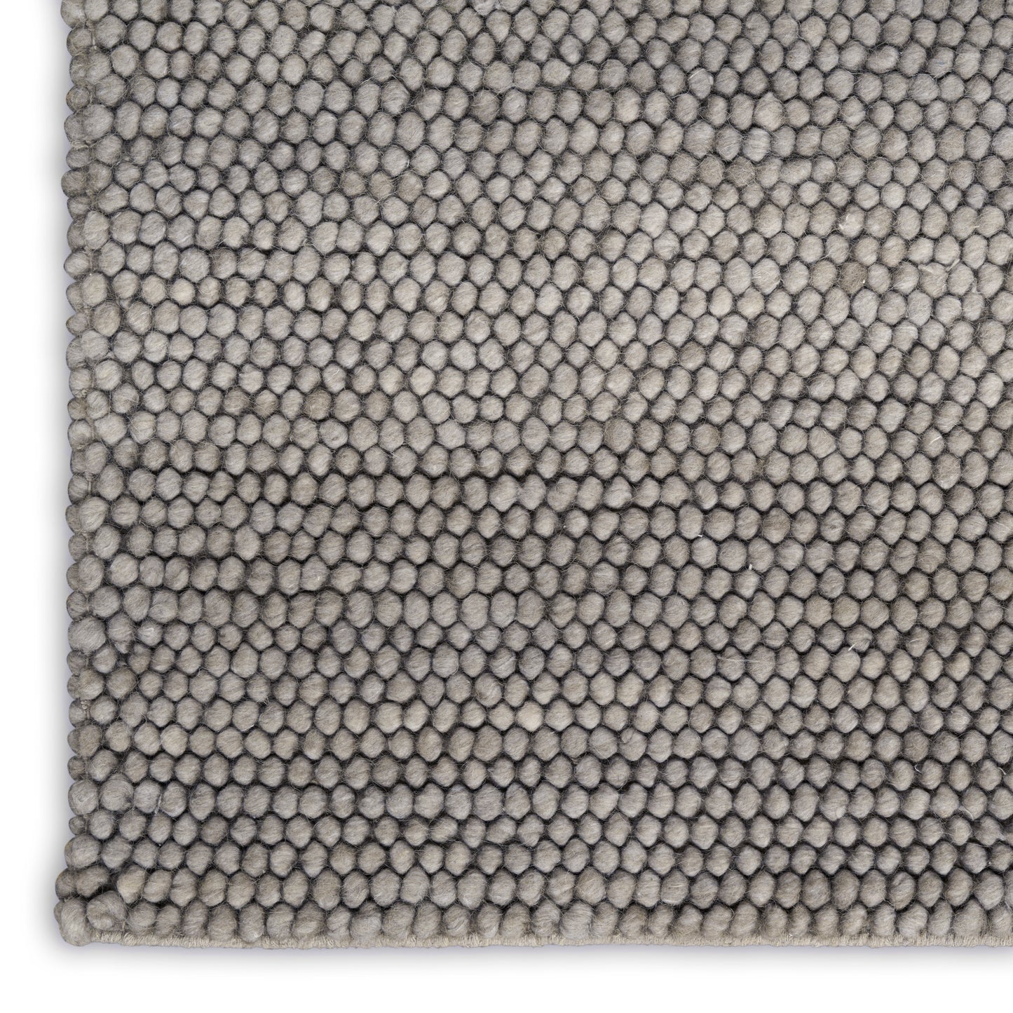 Grey-beige dense loop-pile rug with tiny pebble tufts; modern textured area rug for living room.
