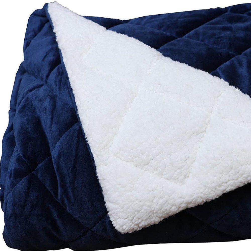 60" X 80" navy blue fleece and microfiber quilted plush throw blanket.