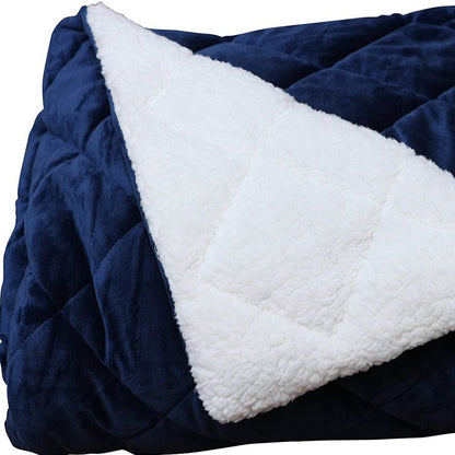 60" X 80" navy blue fleece and microfiber quilted plush throw blanket.