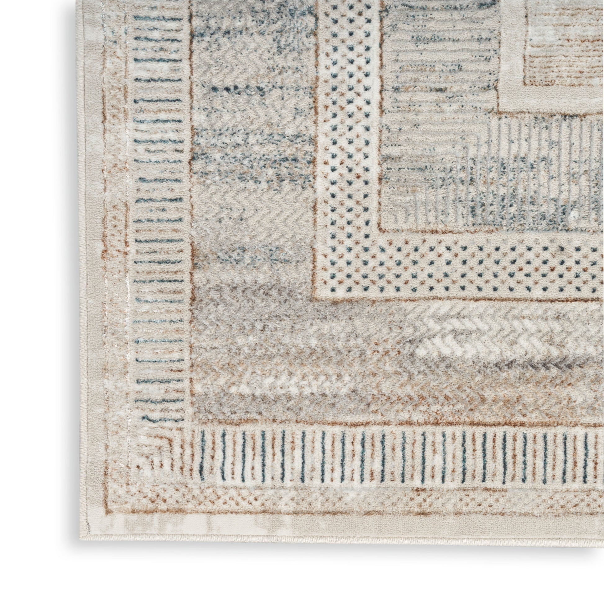 Beige and cream geometric area rug with blue accents and layered border patterns in a soft, textured weave.