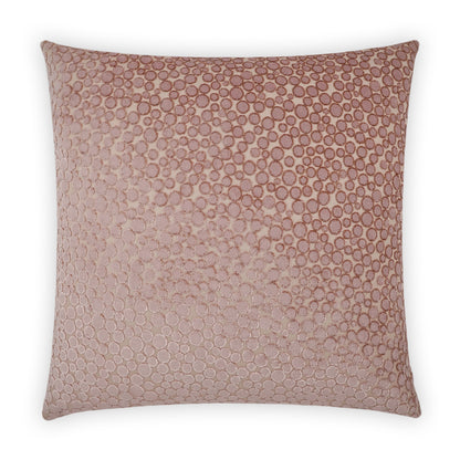 Square blush pink textured throw pillow with embossed circular dot pattern and subtle metallic sheen.
