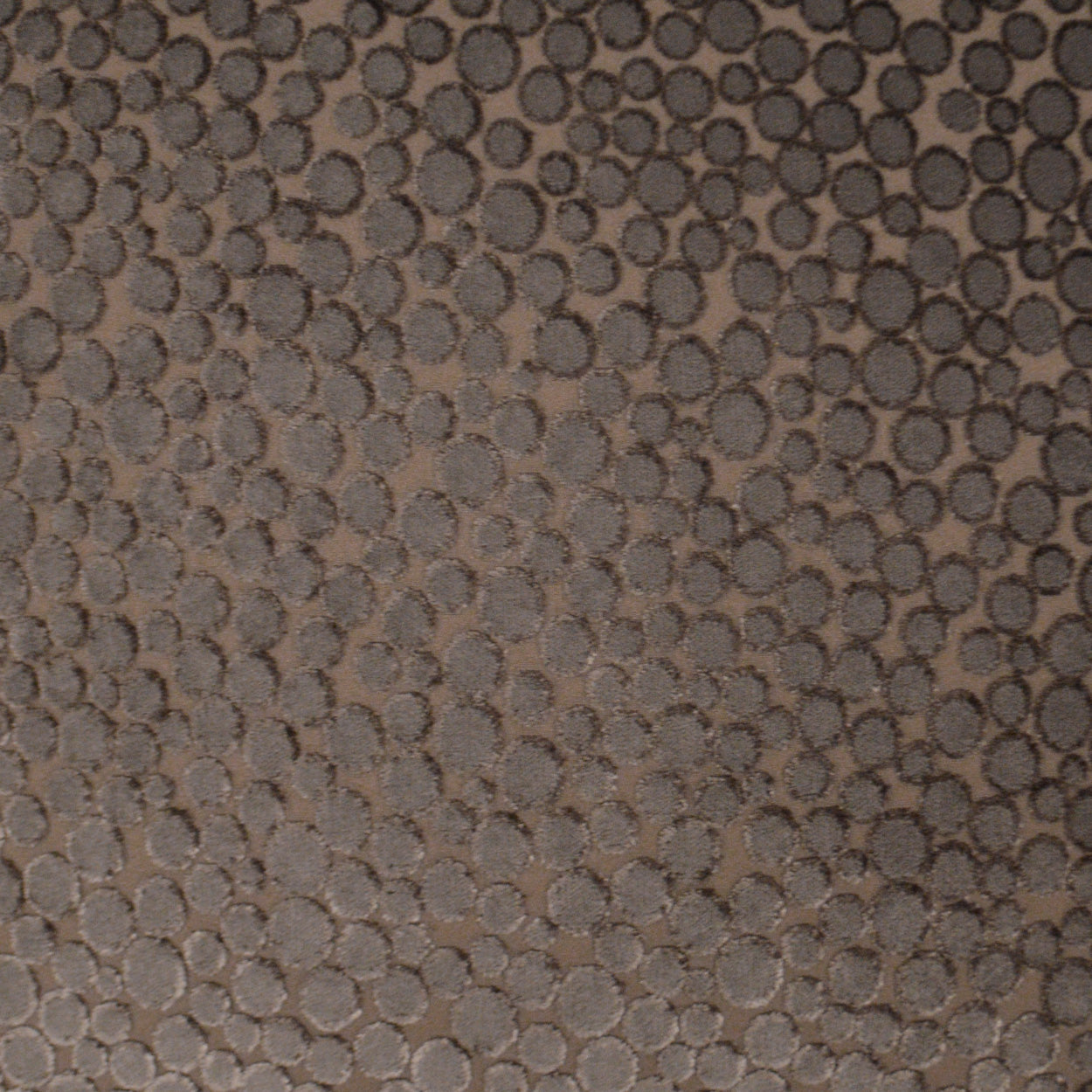 Brown pebble-textured fabric with dense circular embossed dots; suede-like, versatile for bags or upholstery.