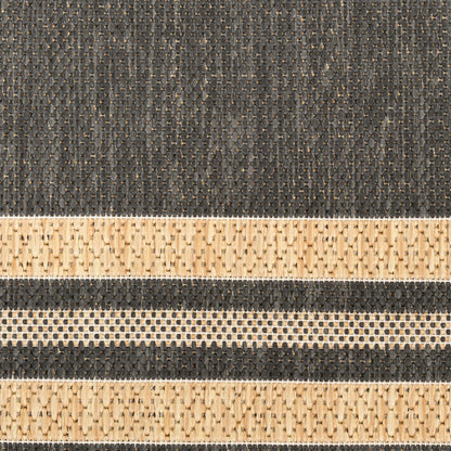 Dark charcoal woven fabric with beige braided stripes and dotted accents, rustic textured textile.